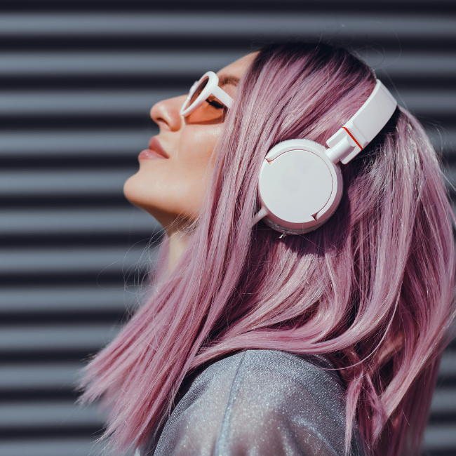 Woman using headphones to listen to music